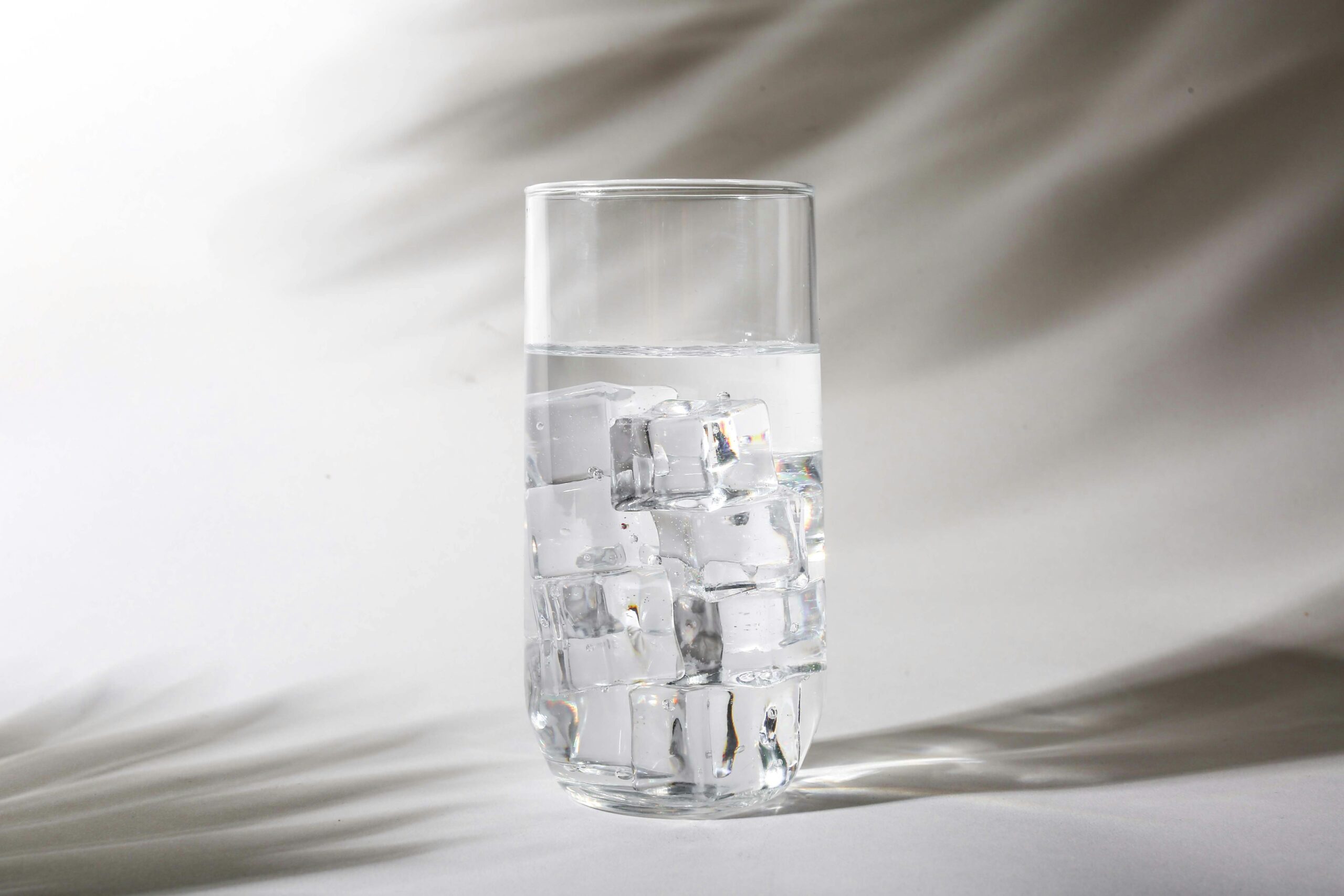 Cloudy or milky water visible in a glass or fixture