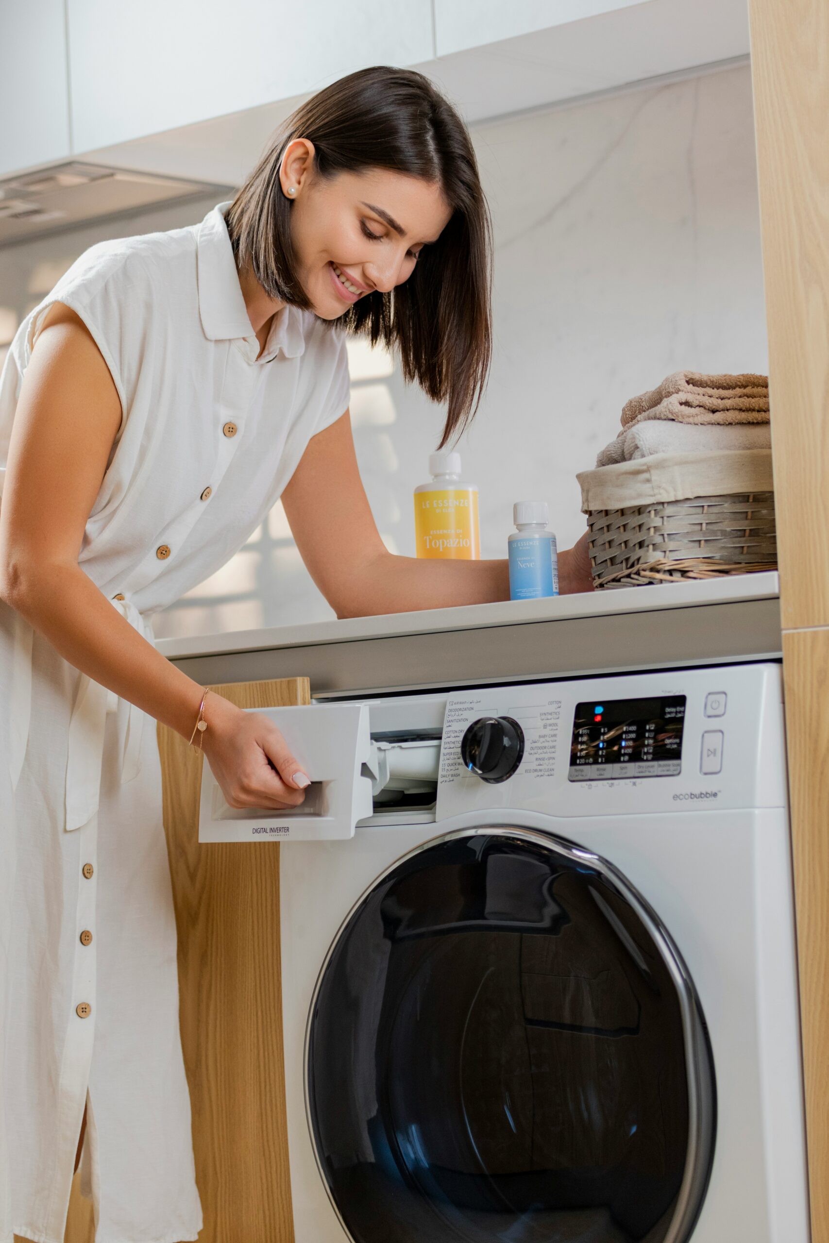 Washing machine water hoses connected to a laundry box