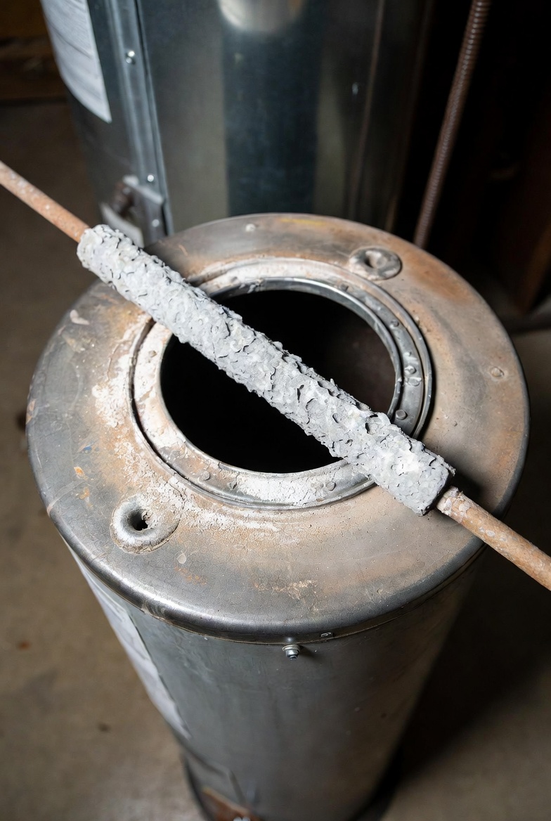 Deteriorated heater anode rod causing hot-only odor