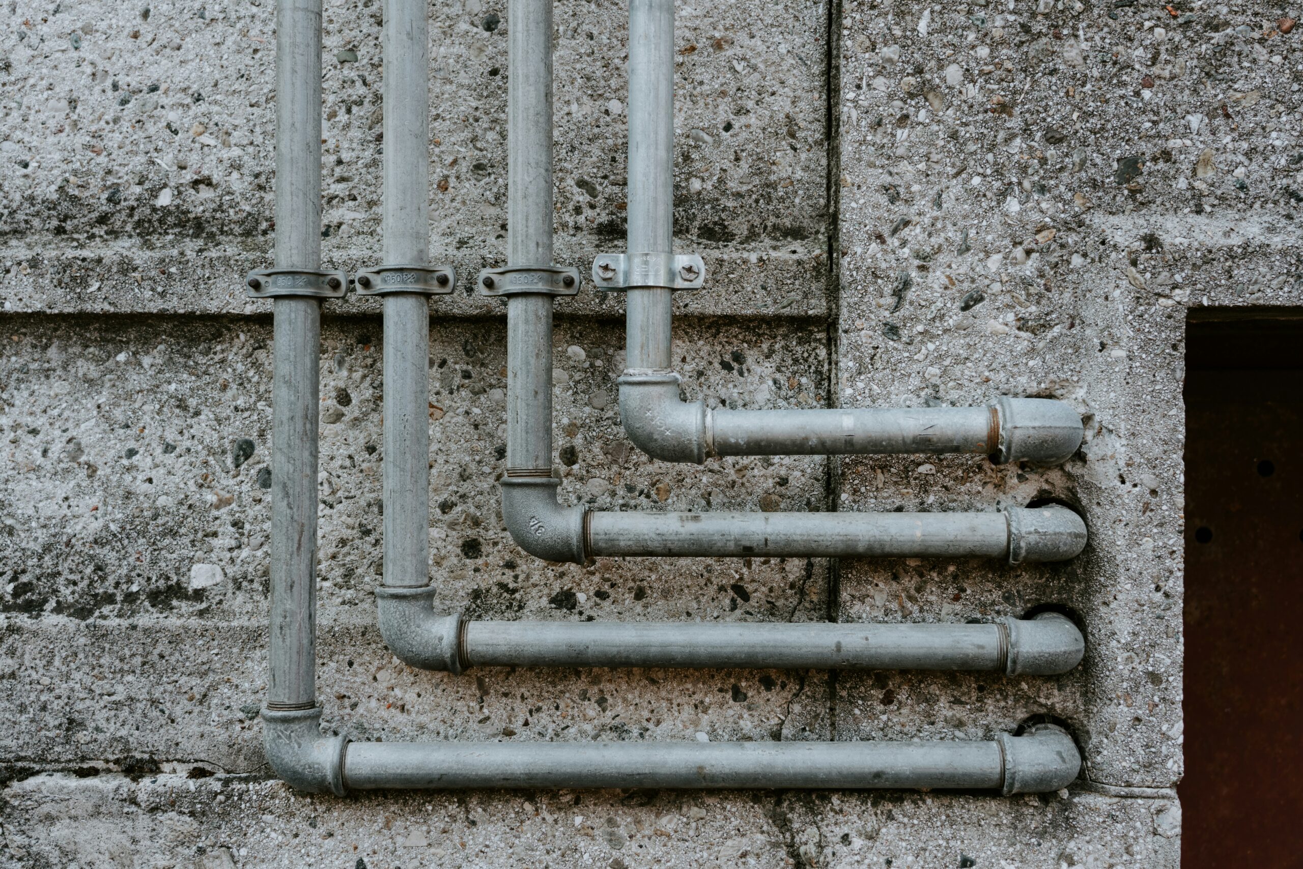 Residential plumbing pipes and joints in a utility area