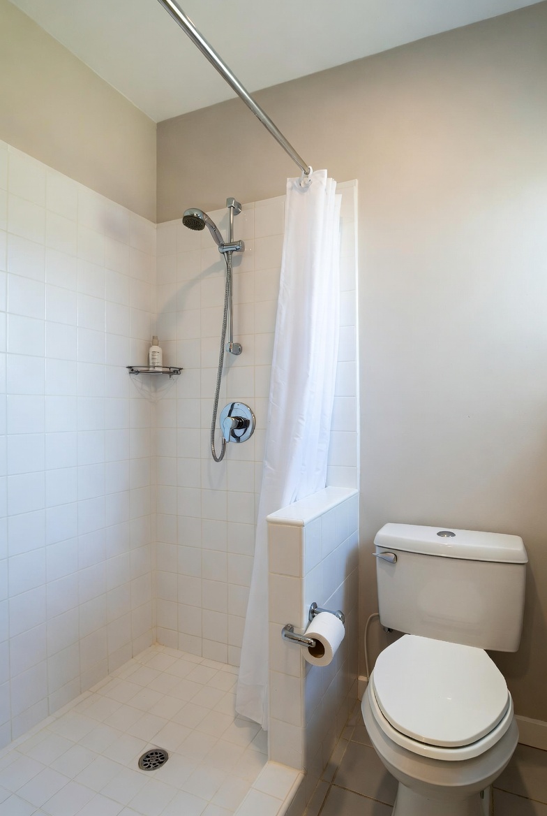 Upstairs bathroom toilet bowl empty while downstairs is fine